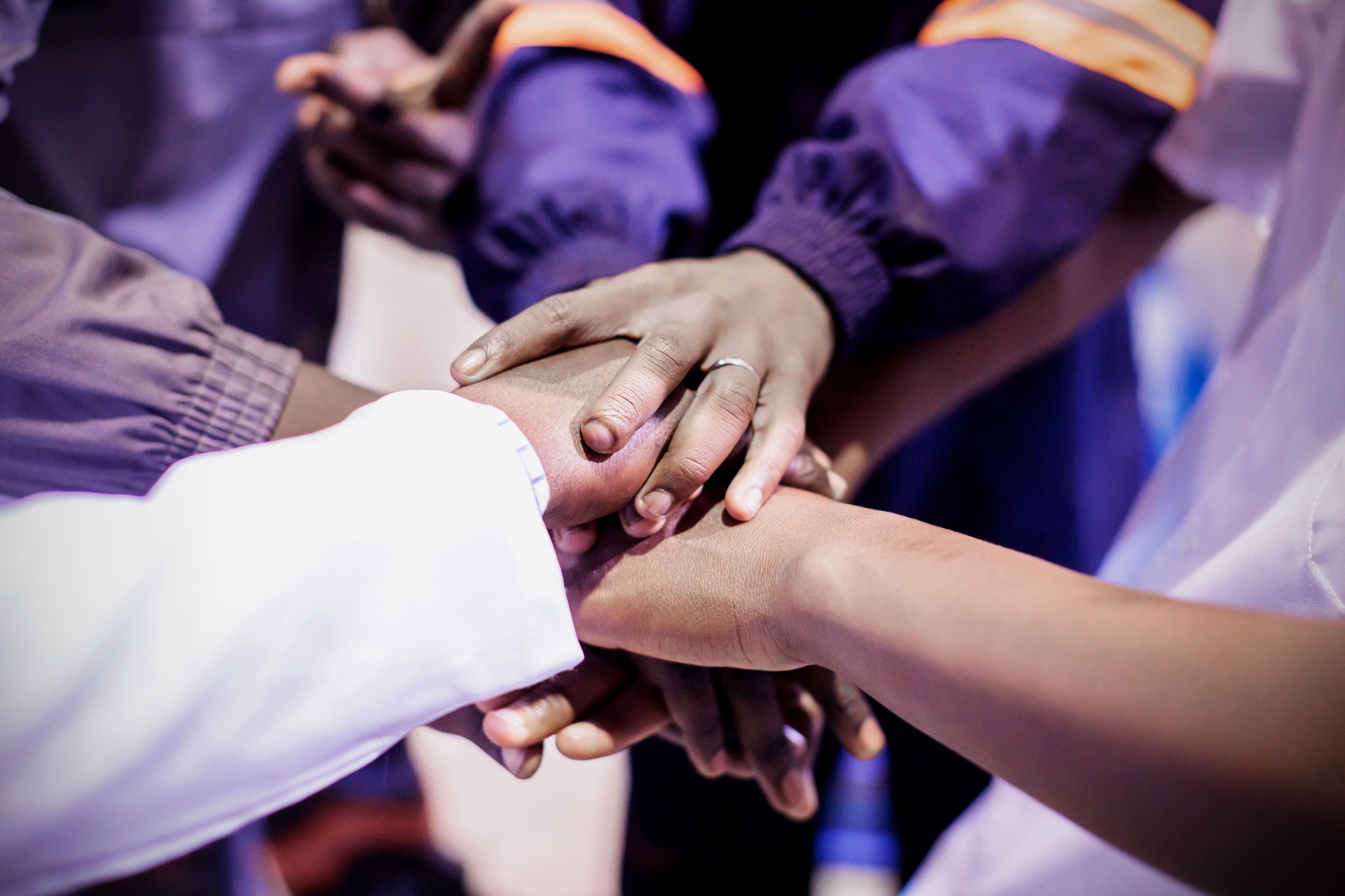 African Factory Workers Joining Hands to Showcase Unity